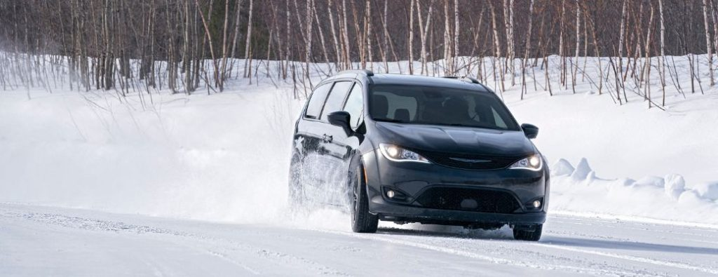 A 2020 Chrysler Pacifica on a snowy terrain