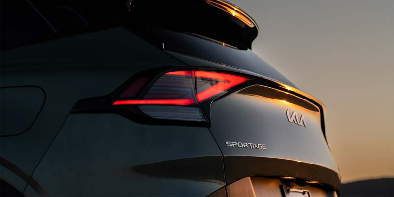 Rear exterior view of the 2025 Kia Sportage highlighting LED taillights and Sportage badging.