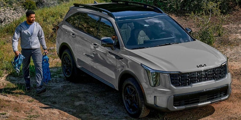 Front-facing view of the Kia Sorento navigating a rugged off-road environment.