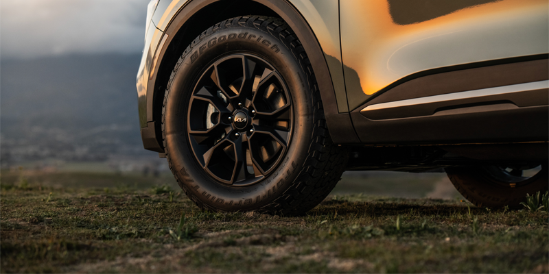 Front three-quarter view of a 2026 Kia Sportage parked outdoors.